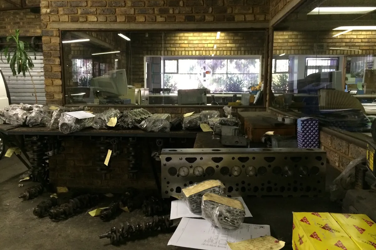 Reconditioned cylinder heads and crankshafts on the counter at Alfissimo Auto Engineering, Nana Sita Street