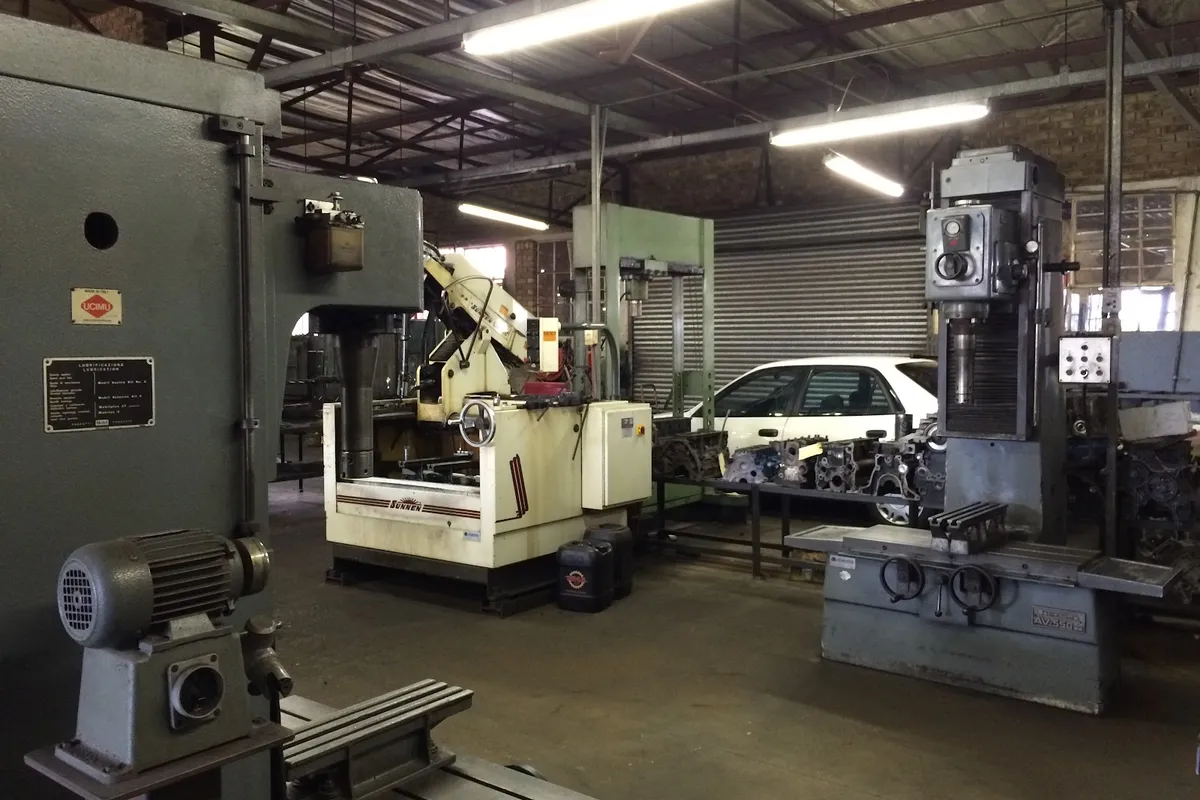 Engine machine shop at Alfissimo Auto Engineering with honing and boring equipment and engine blocks in work